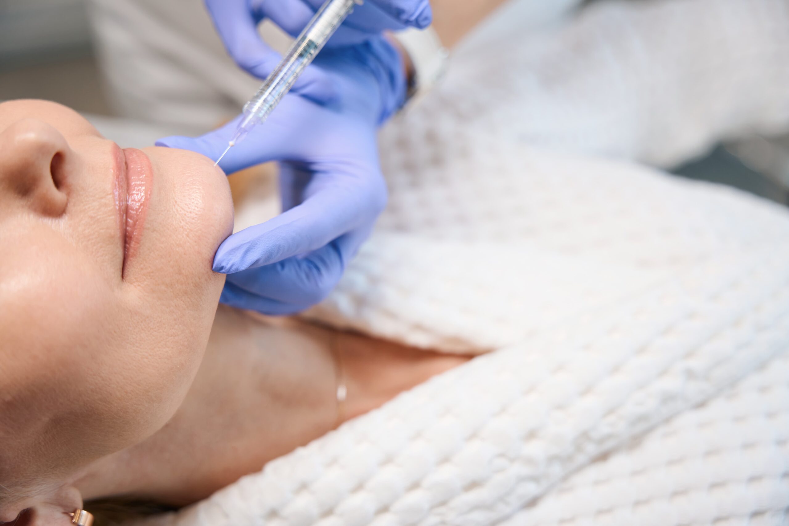 Woman receiving after filler care