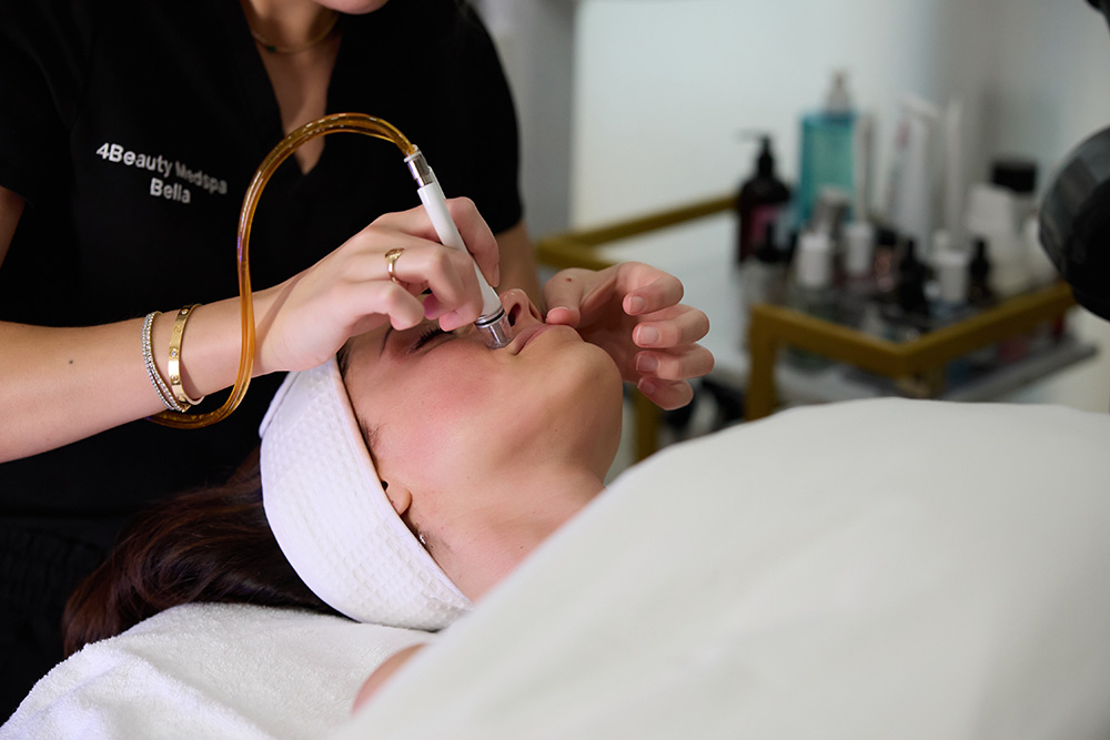 Woman getting diamond glow treatement